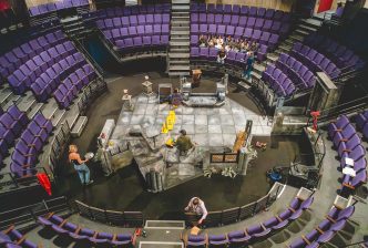 Kiln Sparks participants in the New Vic auditorium with the set of The Haunting. Credit: Andrew Billington