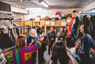 Kiln Sparks backstage training week participants in the costume store. Credit: Andrew Billington